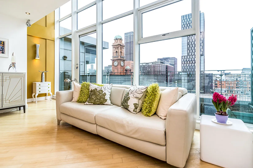 Modern apartment with Manchester City in the background